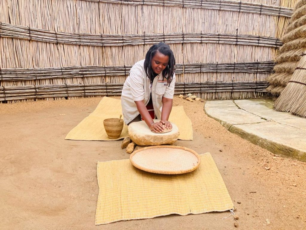 Traditional grain grinding at the King's Palace Museum