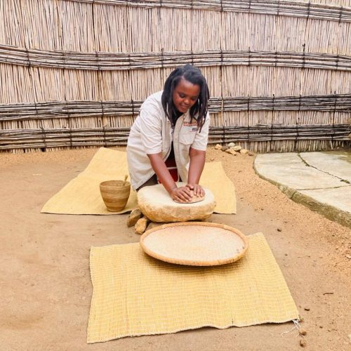 Traditional grain grinding at the King's Palace Museum