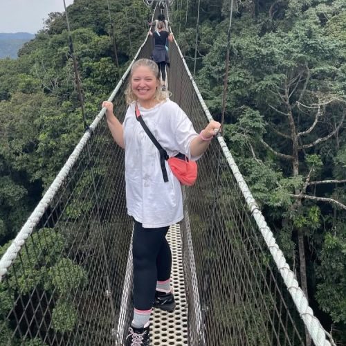 Traveler walking on the Nyungwe Canopy Walk in Rwanda